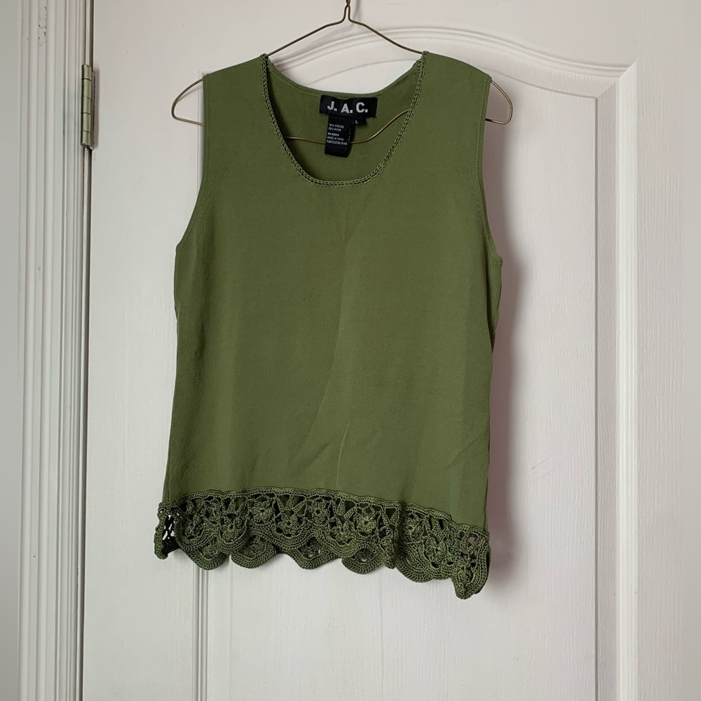 This is a J.A.C. and it is green with some knitted lace on the bottom.